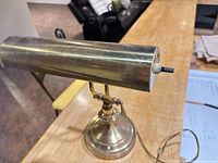 Full lamp, side perspective showing cylindrical shade, stem, base and cord