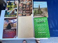 Front covers of all six books laid out