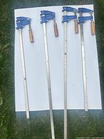 All four bar clamps laid out to show full length and condition