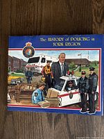 Front cover of The History of Policing in York Region book with police imagery