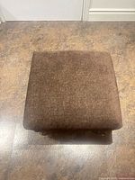 Top view of brown fabric square ottoman