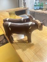Side view of both ox figurines joined by yoke