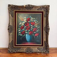 Framed floral oil painting showing full piece and frame details
