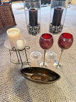 Full group view showing all candle holders, candles and brass dish