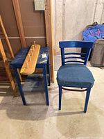 Table, coat rack and chair grouped together