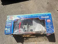 Damaged top view of box showing boat and manual inside