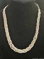 Full view of braided necklace on bust form