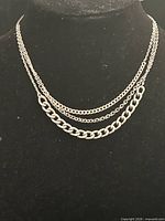 Necklace displayed on bust showing full three-strand design