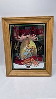 Full front view of framed mirror sign