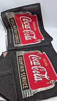 Folded tapestry showing Coca-Cola Fountain Service graphic