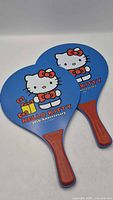 Front view of two Hello Kitty 40th Anniversary paddles