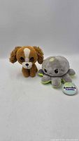 Front view of both plush toys: Ty dog and TeeTurtle octopus