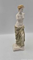 Front view of Venus de Milo statue showing overall form and drapery