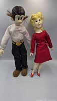 Front view of Dagwood and Blondie dolls standing together