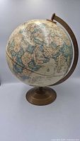 Full view of Globe Masters 12-inch globe on metal stand