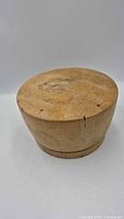Top angled view showing entire wooden hat form