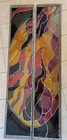 Both stained glass panels shown vertically