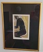 Framed print showing full artwork within gold frame