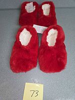 Top view of two pairs red faux fur slipper socks