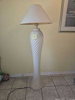 Full view of floor lamp with shade attached