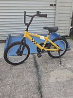 Left side view of complete yellow boy's bicycle
