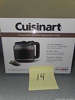 Front of boxed Cuisinart 12-cup black stainless replacement carafe