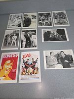 All ten Elvis Presley postcards and movie stills laid out on surface