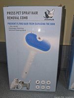 Front view of boxed Jugirun pet spray hair removal comb