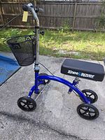 Full view of KneeRover scooter showing frame, wheels, knee pad and basket