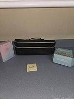 Full lot showing beauty device box, candle box, travel case