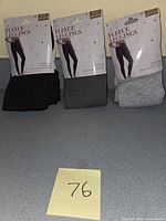 Front view of three packaged leggings showing colors and labels
