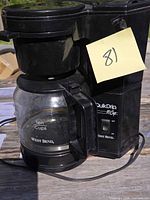Front view showing West Bend QuikDrip unit with carafe and control switch
