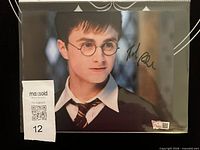 Full view of signed 8x10 photo in sleeve