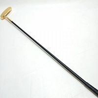 Full view of putter showing gold head and black shaft