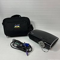 Projector with lens cap, coiled VGA cable and ViewSonic carrying case