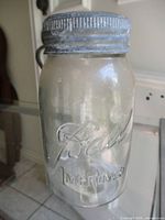 Full view of Ball Improved jar with lid attached