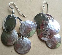 Front view showing hammered discs and overall design of earrings