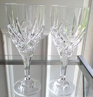 Front view of both goblets showing full shape and cut pattern
