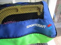 Exterior view of blue and green Sportcraft mesh carrying bag