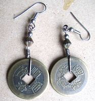 Front view of both earrings showing coin faces, square holes, beaded accents, ear wires