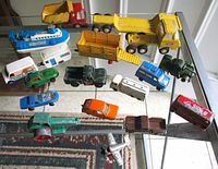 Group shot of all diecast vehicles on glass table