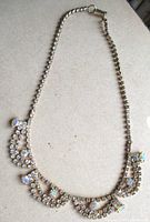 Full view of rhinestone bib necklace laid flat