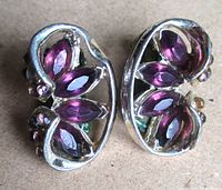 Front view showing leaf motif and marquise garnets