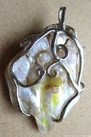 Front view of wire wrapped blister pearl pendant
