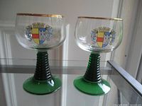 Two goblets front view showing crests and stems