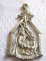 Front view of pewter nativity ornament