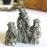 Front view of pewter ornament showing three Wise Men details and hanging loop