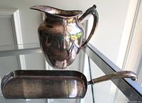 Pitcher and crumb tray overview on glass shelf