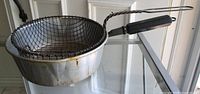 Pot with wire basket inserted, side view
