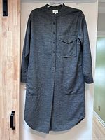 Full front view of grey midi shirt dress hanging